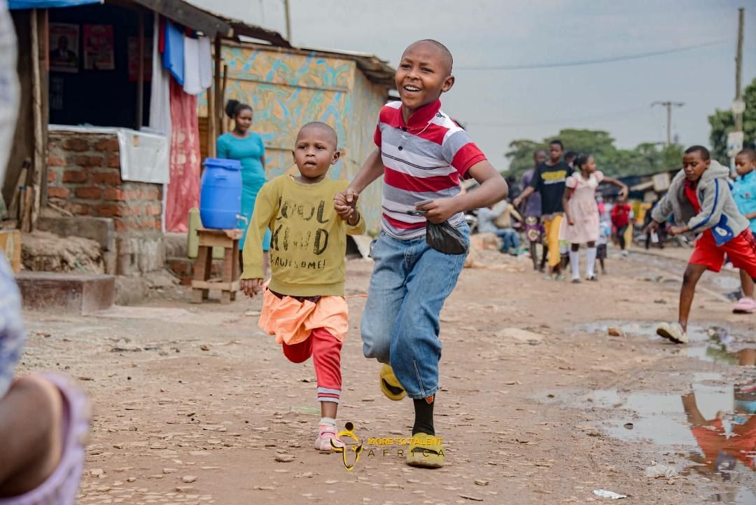 Children running and smiling at a children's ministry in Uganda